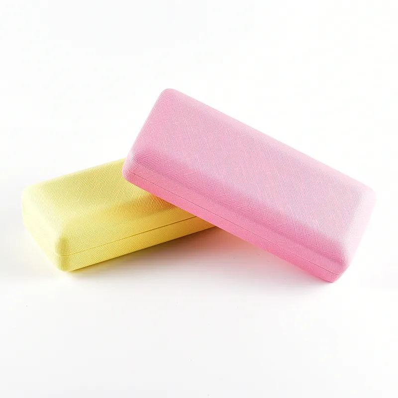 Hard shell eyeglass cases in yellow and pink saffiano-texture finish, closed