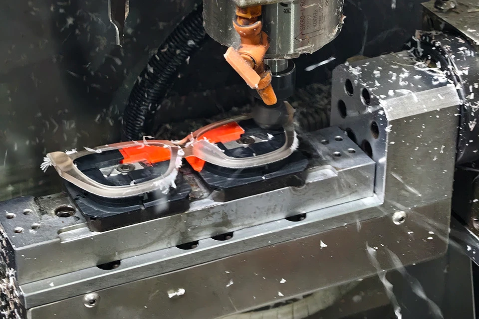 cut acetate frames by cnc milling machine.
