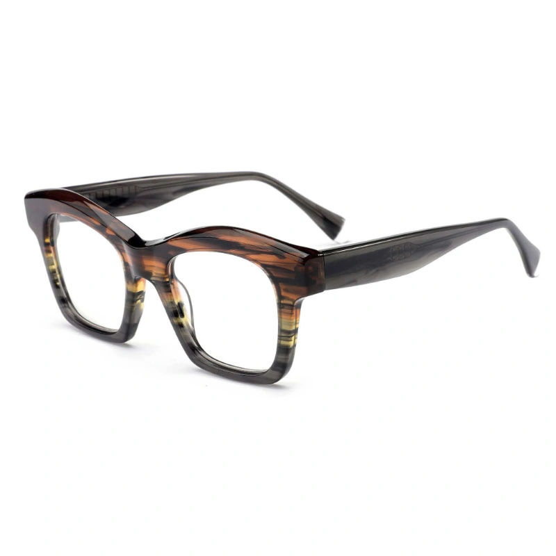 A 3/4 angle view of bold, square acetate eyeglass frames featuring a brown and amber striped front and smoky gray temples, shown on a white background.