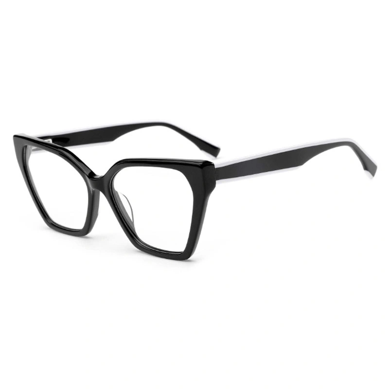 A three-quarter view of sharp, angular cat-eye eyeglasses with a solid black frame and two-tone black and white temples.