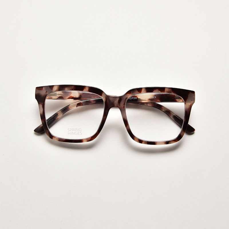 Traditional brown and amber tortoiseshell print reading glasses in a square shape with durable spring hinges.