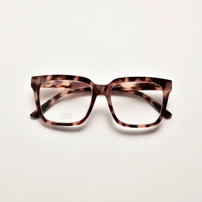 Traditional brown and amber tortoiseshell print reading glasses in a square shape with durable spring hinges.