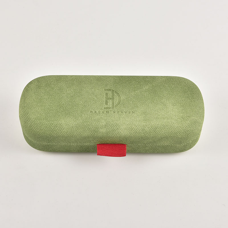 a green hardshell glasses case with a unique fabric texture, showcasing its suitability for private label branding by eyewear companies.