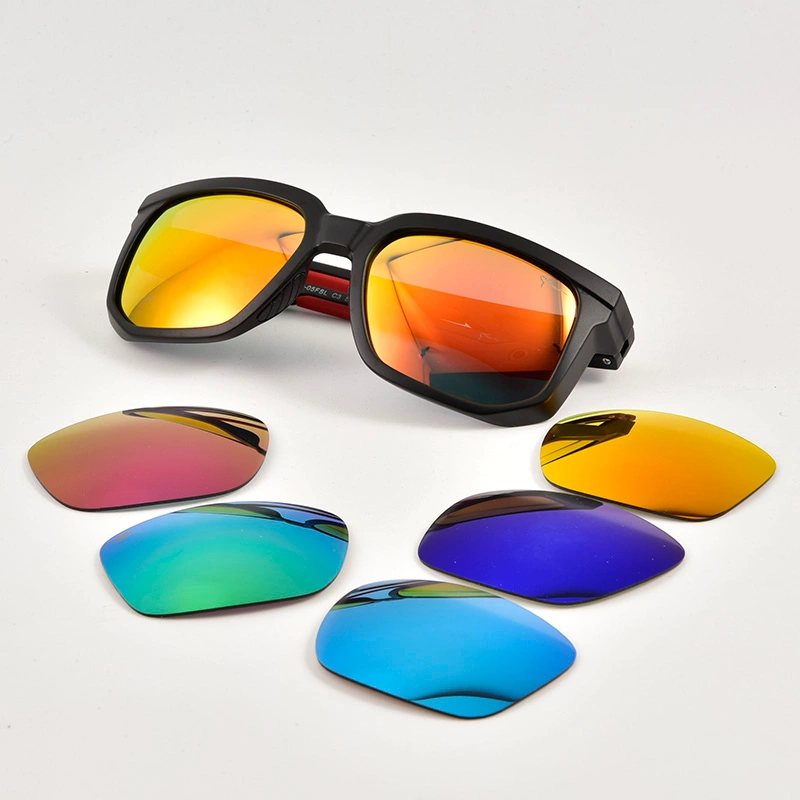Matte black athletic eyewear with a multi-color interchangeable lens kit.