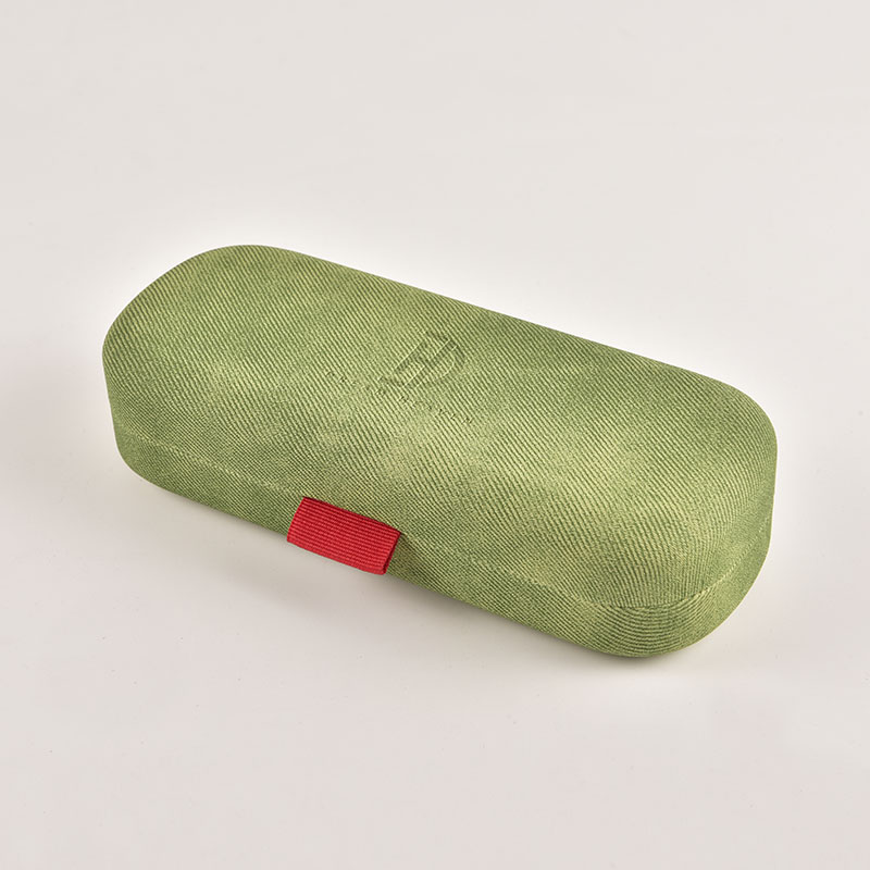 A closed, green hardshell glasses case featuring a modern fabric texture, available for bulk orders from a direct manufacturer.