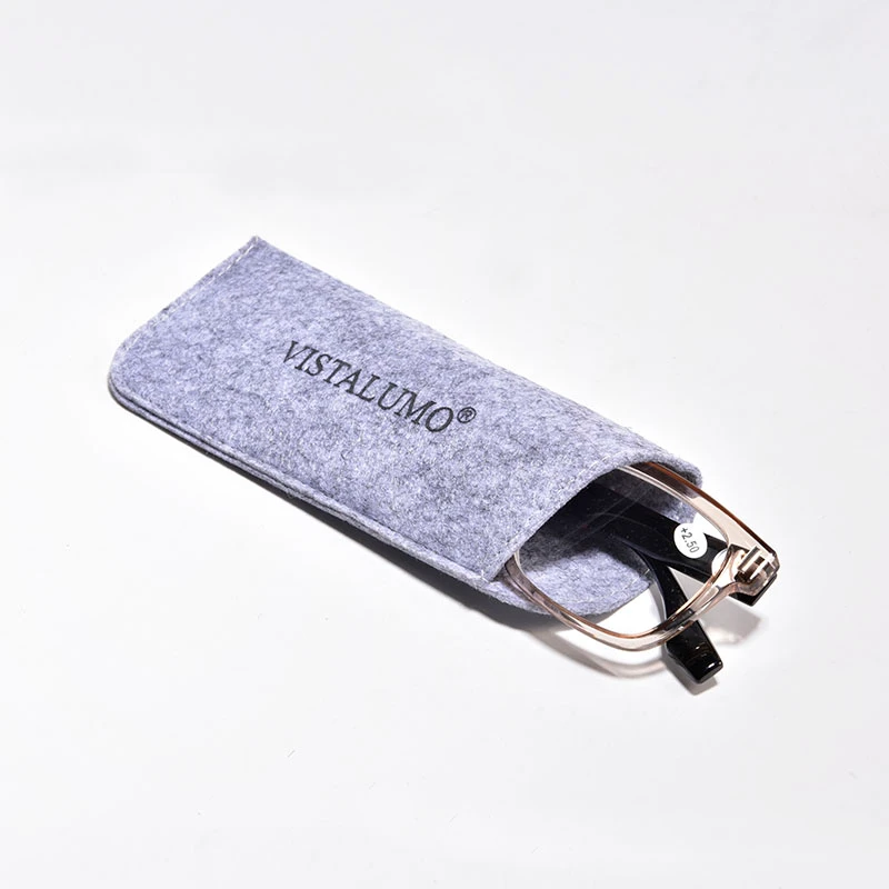 A pair of glasses being placed into the soft felt reader glasses pouch with a logo VISTALUMO on it.