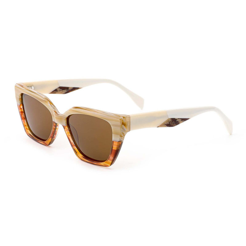 A front view of brown horn patterned laminated acetate sunglasses.