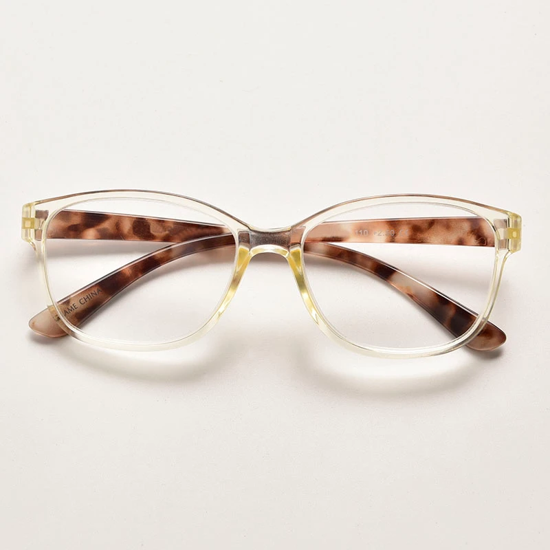 Modern clear front reading glasses with contrasting tortoise shell temples. Durable integral hinge design ideal for custom logo printing and bulk distribution.