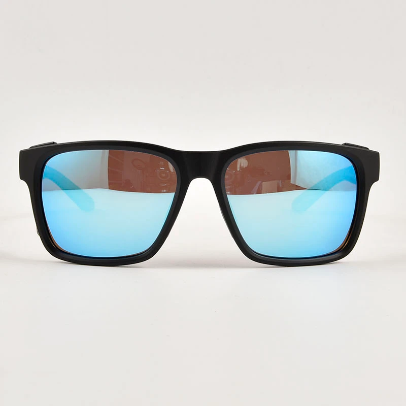 Front view of matte black fishing sunglasses with side shields featuring polarized blue mirror lenses. Professional anti-glare eyewear for offshore angling.