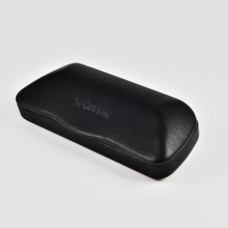 The triangular eyeglass case shown folded completely flat.