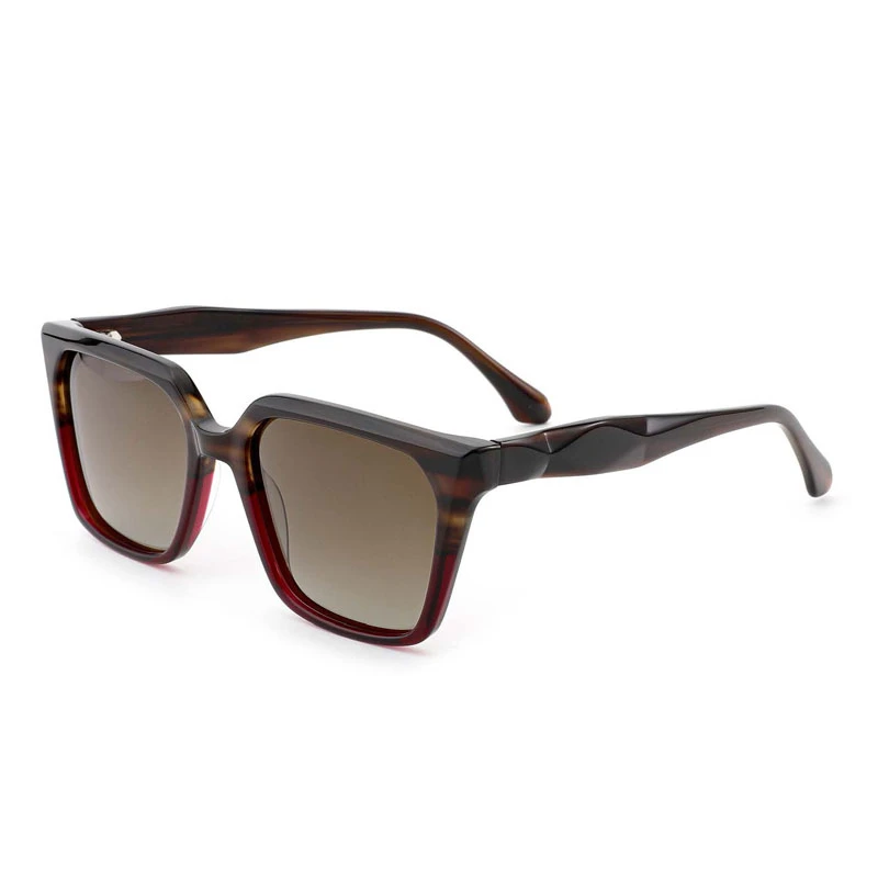 Hand-polished chunky acetate frames in dark tortoise color, detailing durable hinges and smooth finish for bulk production.