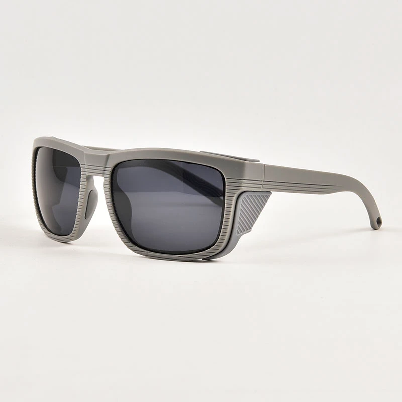 Side profile of mountaineering sunglasses featuring thick side shields and ribbed texture. Specialized snow eyewear (non-driving) available for private label.
