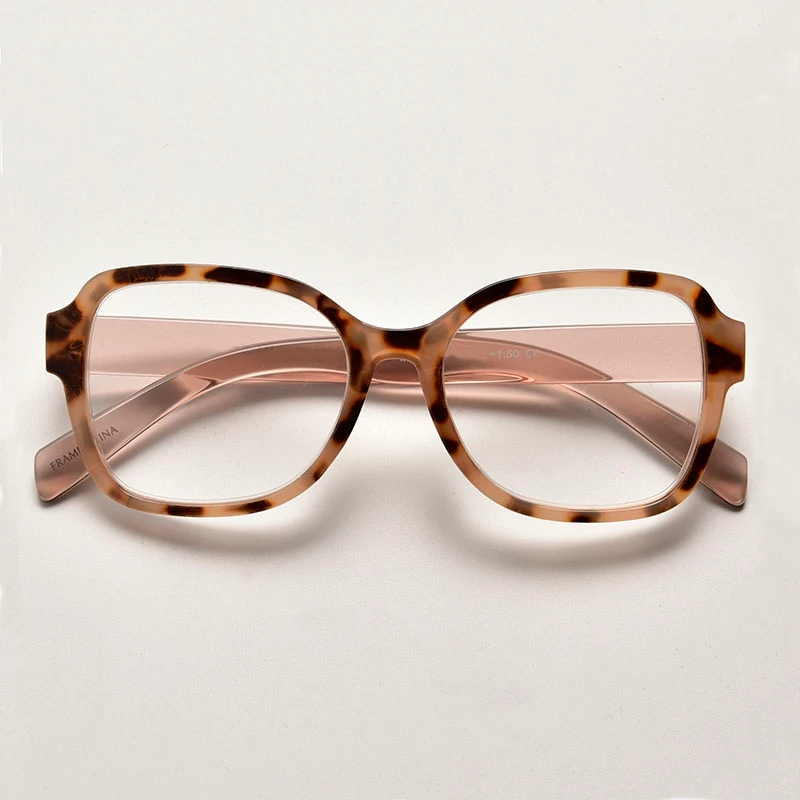 Trendy two-tone tortoise shell and pink eyewear for bulk reading glasses wholesale collections. Stylish bold frame for women featuring wide arms for private label branding.