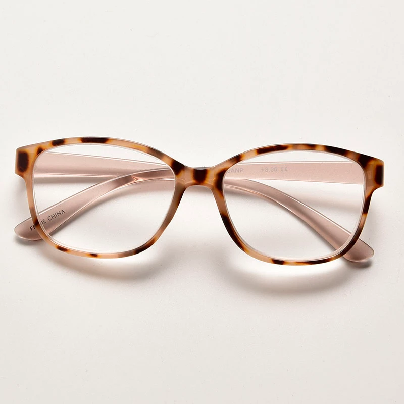 Unisex soft square plastic readers in transparent brown tea color. Ergonomic lightweight design with fixed hinges, perfect for daily wear. CE approved.