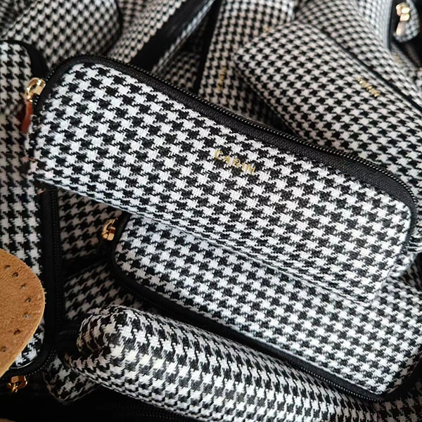 Bulk production of black soft microfiber glasses pouches.