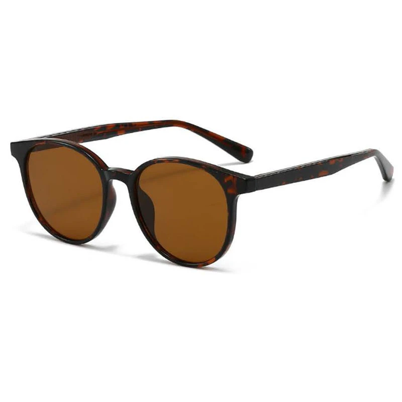 a tortoiseshell color sunglasses in round frame and tea lenses.