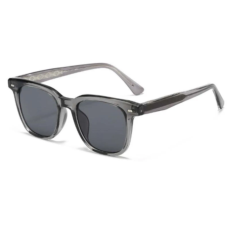 Angled view of unisex TR90 sun glasses in a sleek transparent grey.