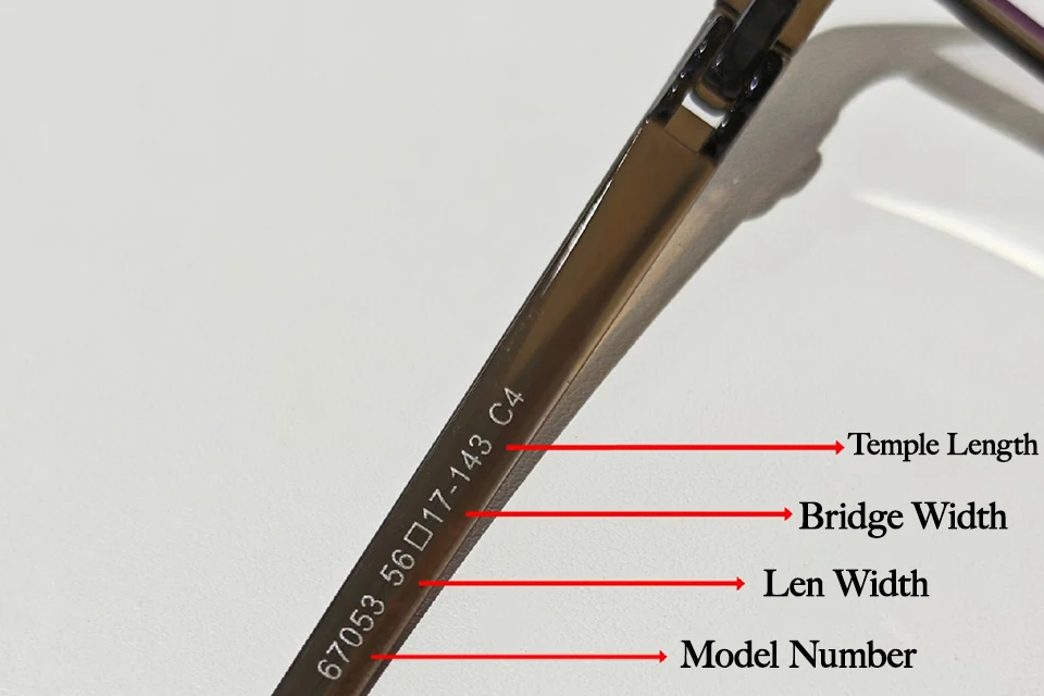 Eyeglass frame measurements on temple arm showing model number, lens width, bridge width, and temple length labeled for reading frame size.